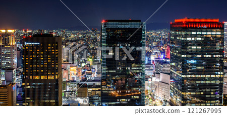Cityscape night view of Osaka downtown from Umeda Sky Building observation deck in Osaka, Japan 121267995