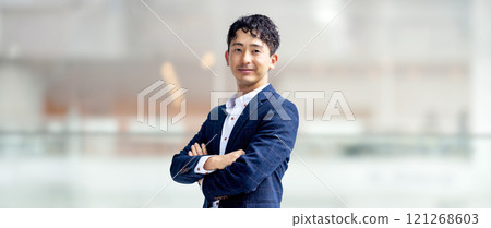 Male businessman folding his arms 121268603