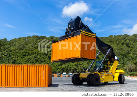 Reach stacker cargo forklift container box import export logistic transportation industrial, Reach stacker pick up container, Reach stacker container loader crane lifting maritime cargo container. 121268996