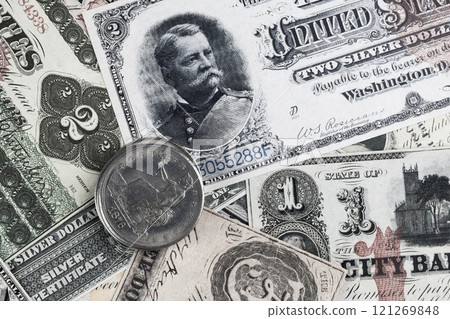Old west greenback US paper money and silver certificates with silver dollar coins Old west greenback US paper money and silver certificates with silver dollar coins 121269848