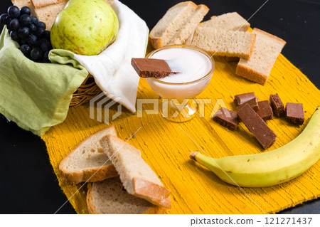 Breakfast spread with fruit, bread, yogurt, and chocolate. Breakfast spread with fruit, bread, yogurt, and chocolate. 121271437