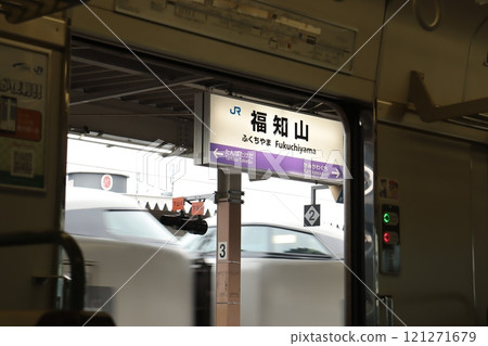 Fukuchiyama Station sign and express train 121271679