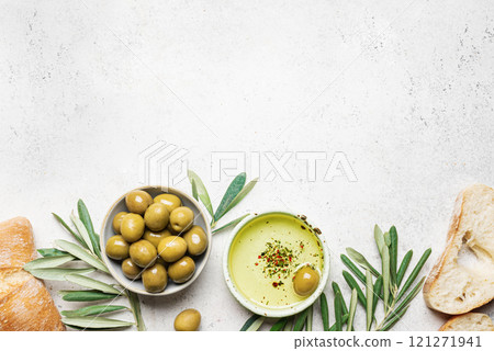 Olive oil with olives and bread 121271941