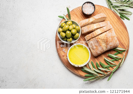 Olive oil with olives and bread Olive oil with olives and bread 121271944