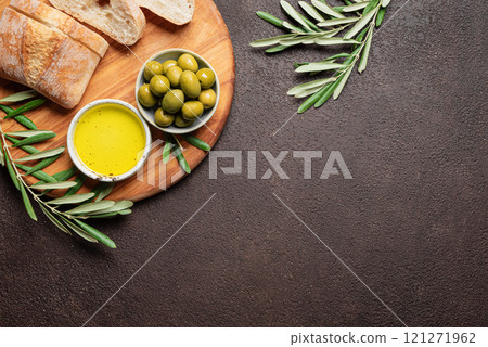 Olive oil with olives and bread Olive oil with olives and bread 121271962