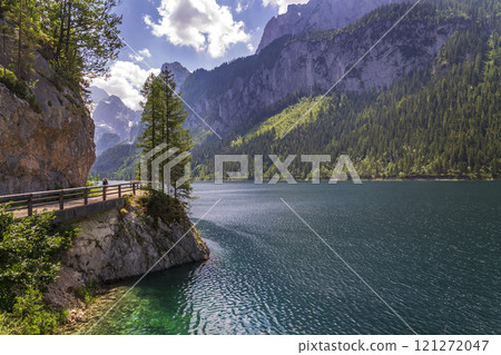 Beautiful nature on the shores of the Vorderer Gosausee lake near Gosau, Austria, sunny summer day Beautiful nature on the shores of the Vorderer Gosausee lake near Gosau, Austria, sunny summer day 121272047