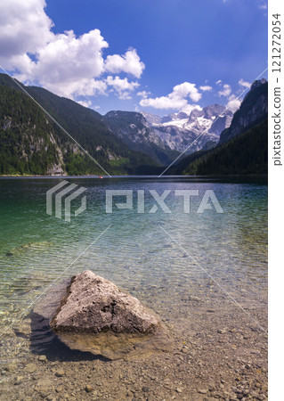Beautiful nature on the shores of the Vorderer Gosausee lake near Gosau, Austria, sunny summer day Beautiful nature on the shores of the Vorderer Gosausee lake near Gosau, Austria, sunny summer day 121272054