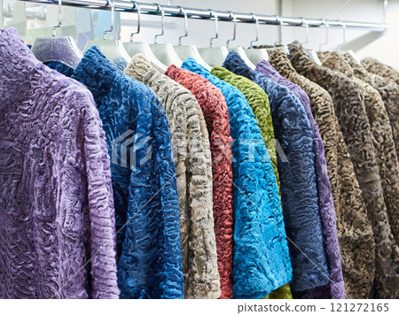 Colored fur coats of goat and sheep in shop 121272165
