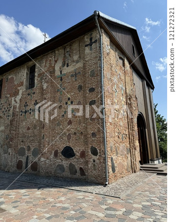 Historic Brick Church Wall with Stone Decorations 121272321