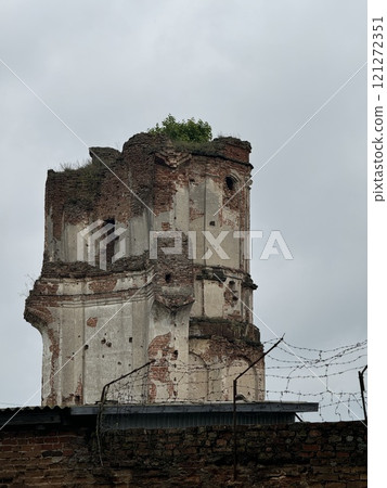 Weathered Brick Tower with Overgrown Top 121272351