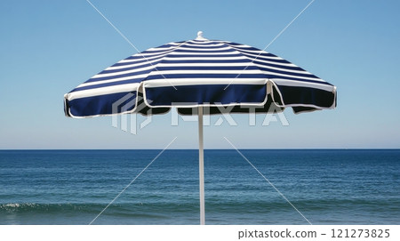 Relaxing at a beachside pool with a striped umbrella and ocean view in clear weather 121273825