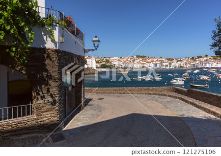 Facades of traditional white houses on the waterfront in Cadaques, Spain Facades of traditional white houses on the waterfront in Cadaques, Spain 121275106