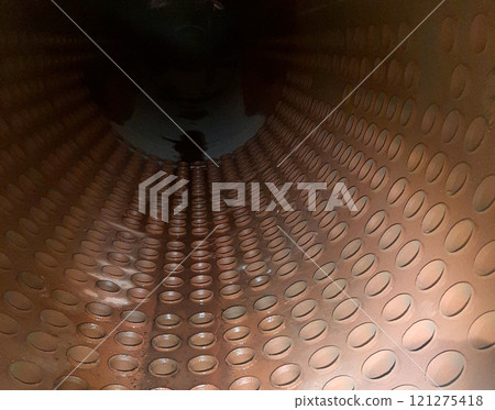 Internal View of a Steam Boiler Drum Showcasing Rolled Tubes in an Industrial Setting 121275418
