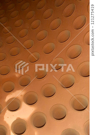 Internal View of a Steam Boiler Drum Showcasing Rolled Tubes and Perforated Surface 121275419
