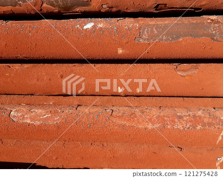 Horizontal pipes from an industrial gas-fired steam boiler are covered with rusty limestone deposits Horizontal pipes from an industrial gas-fired steam boiler are covered with rusty limestone deposits 121275428