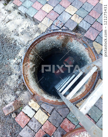 Repairing Sewage Well With Collapsed Cobblestone Surface in Urban Area Repairing Sewage Well With Collapsed Cobblestone Surface in Urban Area 121275431