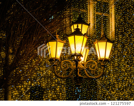 urban lantern and garlands in background in night 121275597