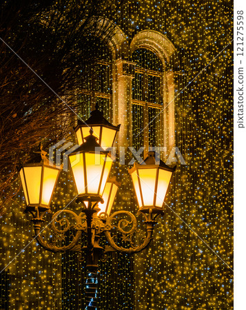 urban lamps and garlands on wall in background 121275598