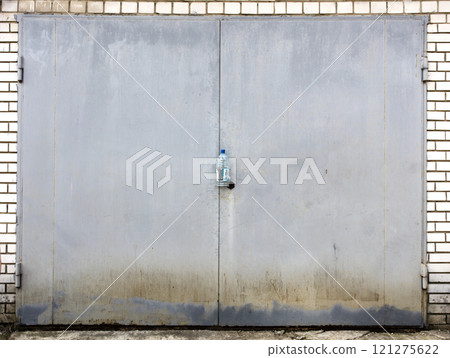 old metal door to the car garage 121275622
