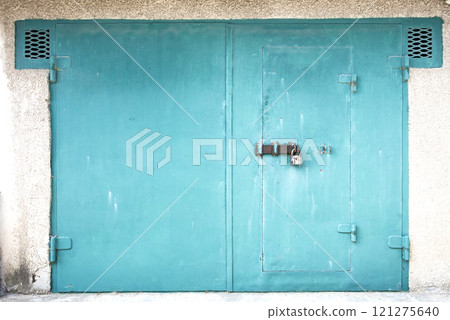 old metal door to the car garage 121275640