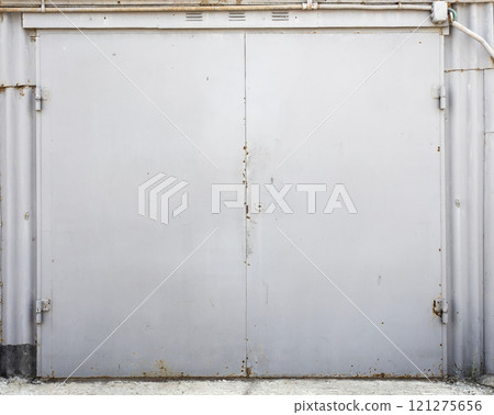 old metal door to the car garage old metal door to the car garage 121275656