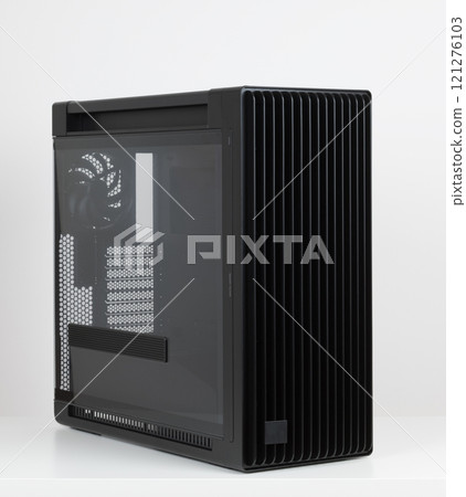 Side view of empty big tower, PC case, chassis, tempered-glass left panel has a mesh window to aid in graphics-card ventilation Side view of empty big tower, PC case, chassis, tempered-glass left panel has a mesh window to aid in graphics-card ventilation 121276103