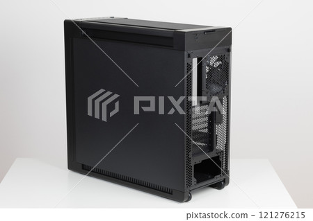 Back side of empty  big  tower computer case, chassis , effortless maneuvering with two built-in  wheels on white background. At the bottom is a place for  power supply unit 121276215