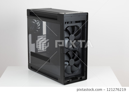 Two 200mm pre-installed system fans, front panel IR dust indicator. Side view of empty big tower, PC case, chassis. Left panel is tempered-glass. Two 200mm pre-installed system fans, front panel IR dust indicator. Side view of empty big tower, PC case, chassis. Left panel is tempered-glass. 121276219