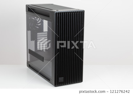 Side view of empty big tower, PC case, chassis, tempered-glass left panel has a mesh window to aid in graphics-card ventilation Side view of empty big tower, PC case, chassis, tempered-glass left panel has a mesh window to aid in graphics-card ventilation 121276242
