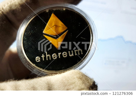 Ethereum silver metal coin in capsule and gold rhombus symbol of cryptocurrency Ethereum silver metal coin in capsule and gold rhombus symbol of cryptocurrency 121276306