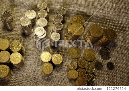 Stacked Ukrainian Coins Displaying Modern Circulation Currency Varieties on a Neutral Background 121276314