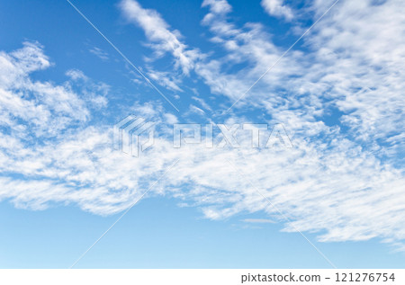 White clouds in a bright blue sky. The beauty of the nature	 121276754