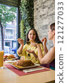 Women sharing traditional ecuadorian food in madrid restaurant 121277033