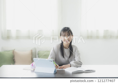 Elementary school students learning on tablets Elementary school students learning on tablets 121277407