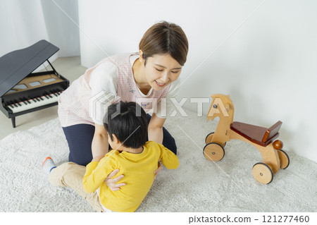 A woman feeding her baby A woman feeding her baby 121277460
