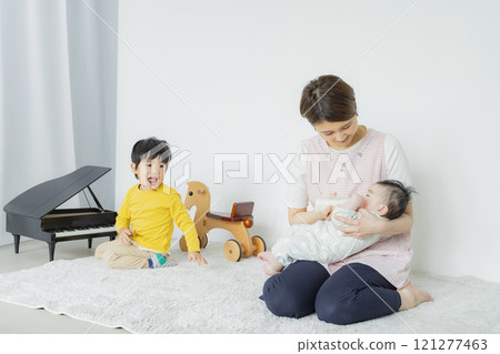 A woman feeding her baby A woman feeding her baby 121277463
