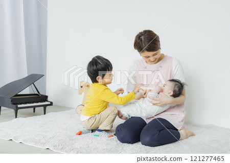 A woman feeding her baby A woman feeding her baby 121277465