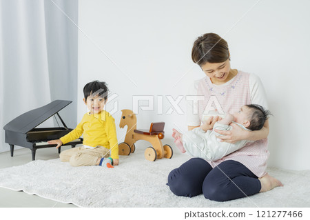 A woman feeding her baby A woman feeding her baby 121277466