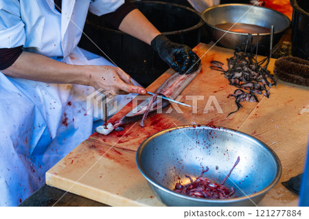 Splitting fresh eel Splitting fresh eel 121277884