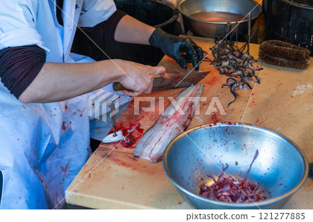 Splitting fresh eel Splitting fresh eel 121277885
