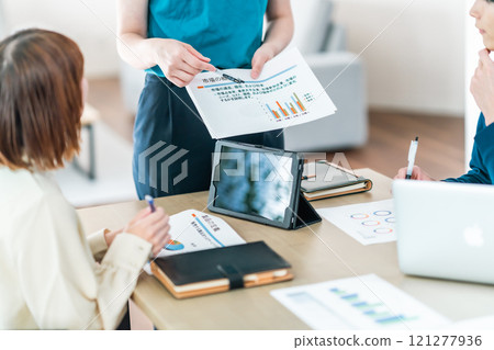 Businesswoman explaining graph analysis (no face) 121277936