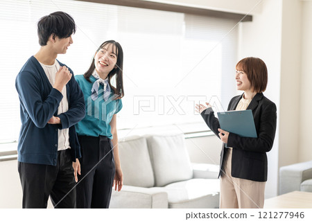 Young couple viewing a property 121277946