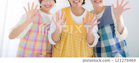 Smiling nursery teachers and housekeepers looking at the camera, image of job change or job offer, waving goodbye, faceless banner Smiling nursery teachers and housekeepers looking at the camera, image of job change or job offer, waving goodbye, faceless banner 121278469