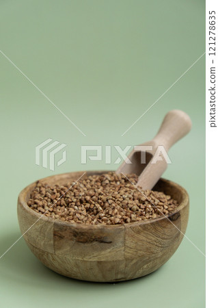Raw buckwheat porridge Gluten free cereals. Health gut benefits. Concept of alternative whole spelt grain ingredient. Vegetarian diet recipes. Plant-based lifestyle. Copy space Protein rich Raw buckwheat porridge Gluten free cereals. Health gut benefits. Concept of alternative whole spelt grain ingredient. Vegetarian diet recipes. Plant-based lifestyle. Copy space Protein rich 121278635