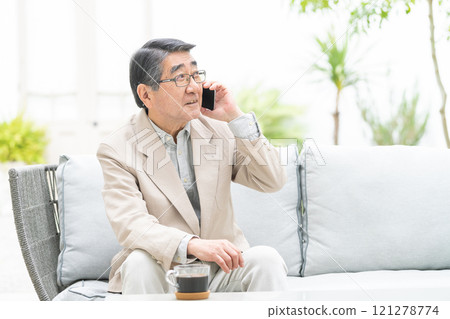 Senior man talking on a smartphone 121278774