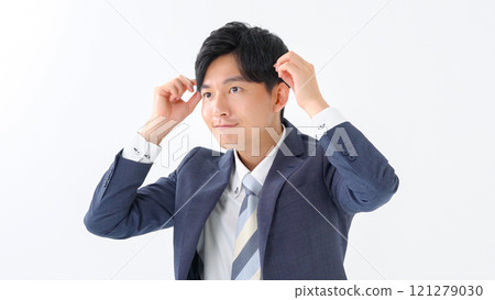 Businessman doing hair styling 121279030