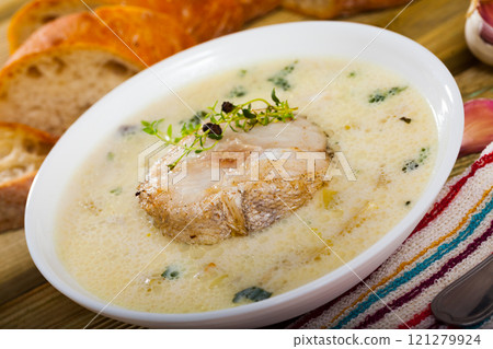 Creamy soup with codfish 121279924