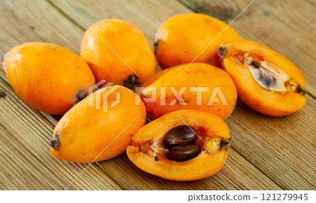 Loquat on wooden table 121279945