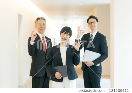 Men and women in suits making an OK pose Men and women in suits making an OK pose 121280411