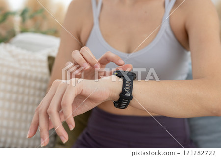 Person pointing touching at smart watch screen display. smart wristwatch use for text electronice, Message notifications, heart rate measurement during exercise. 121282722